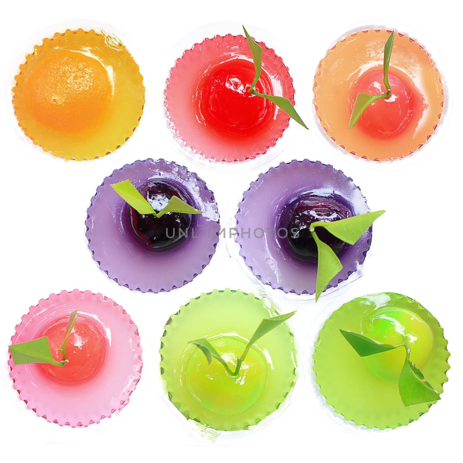 Different colored jelly sweets with white background
