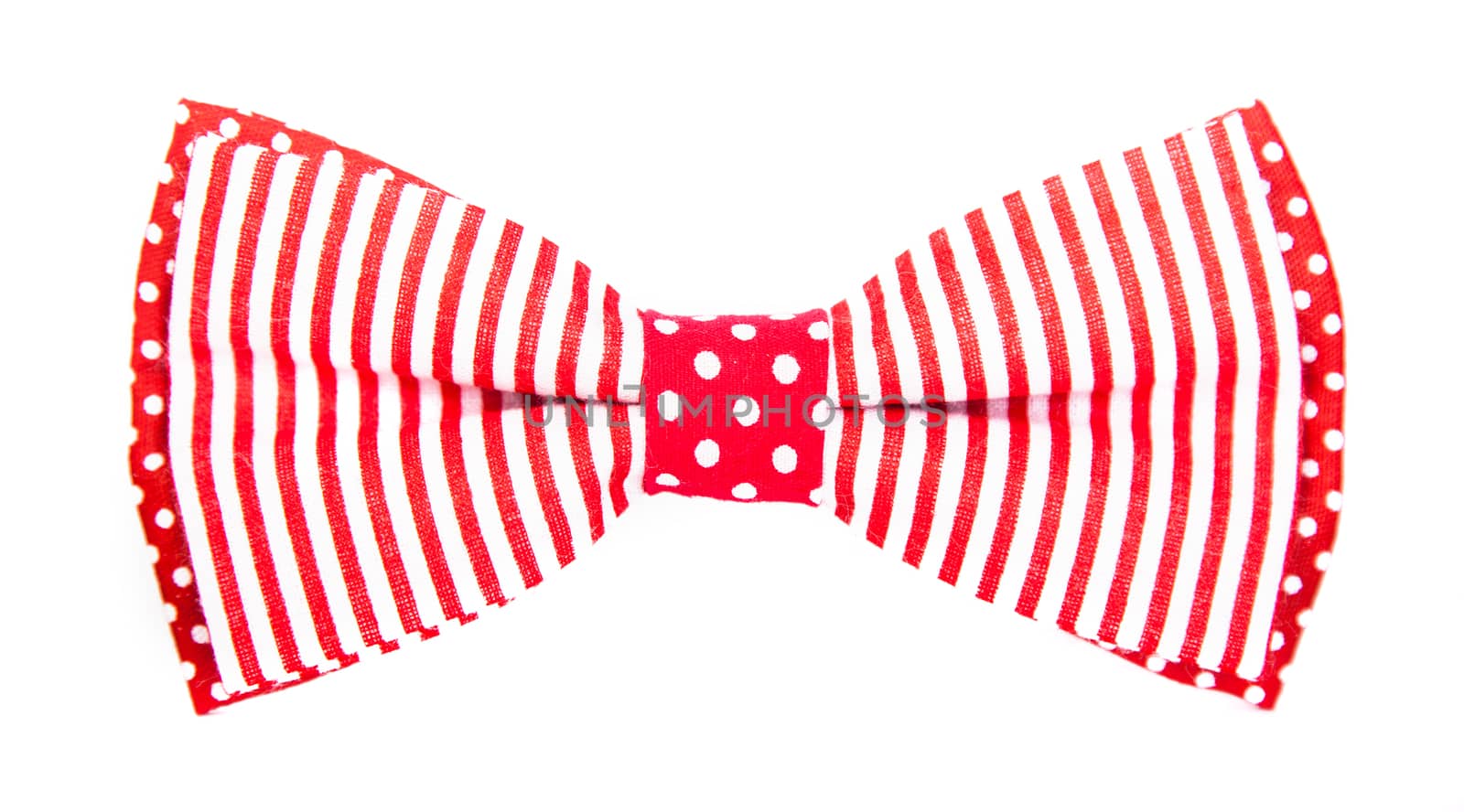 red bow tie with stripes and polka dots on an isolated white background