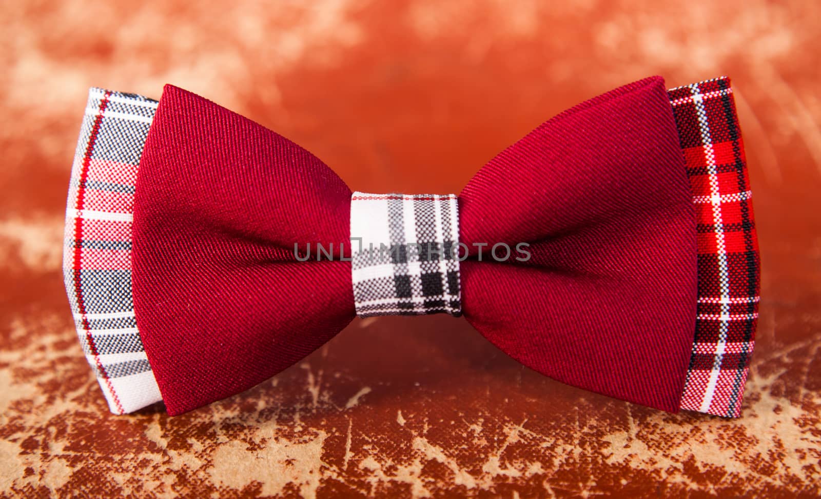 red bow tie with a black pattern