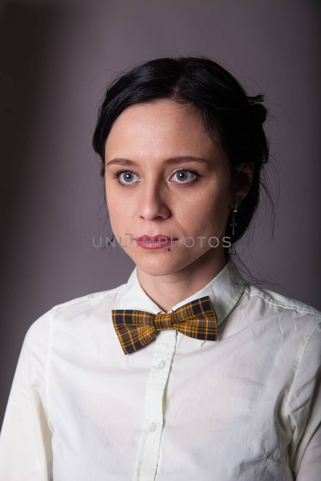 Girl brunette office worker with bow tie