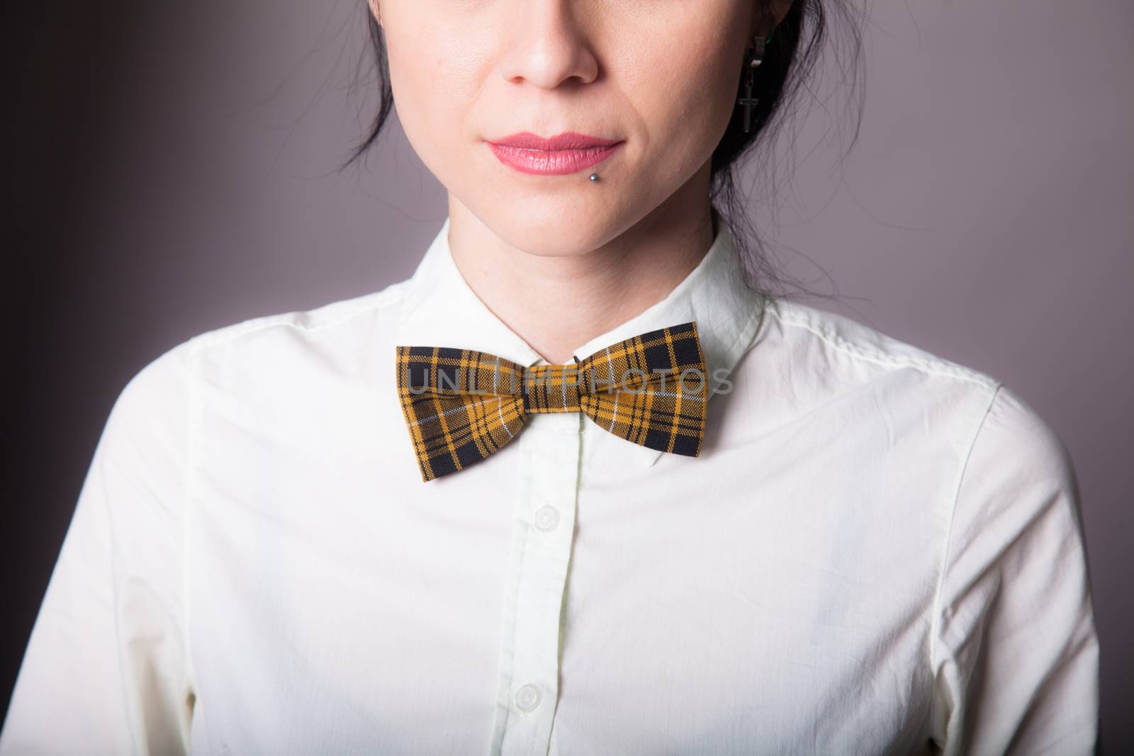 Girl brunette office worker with bow tie