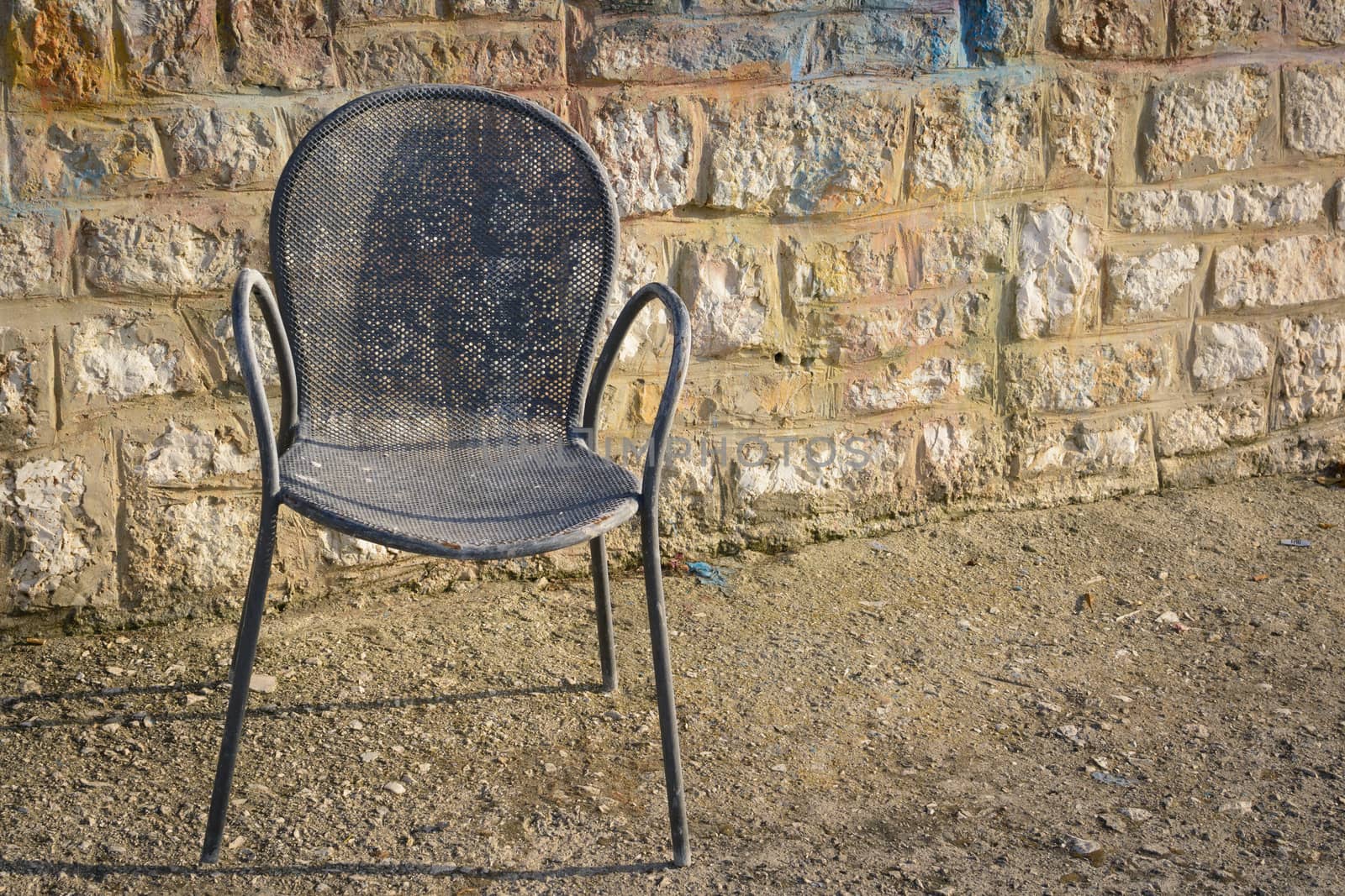 Old rusty metal chair found in the port