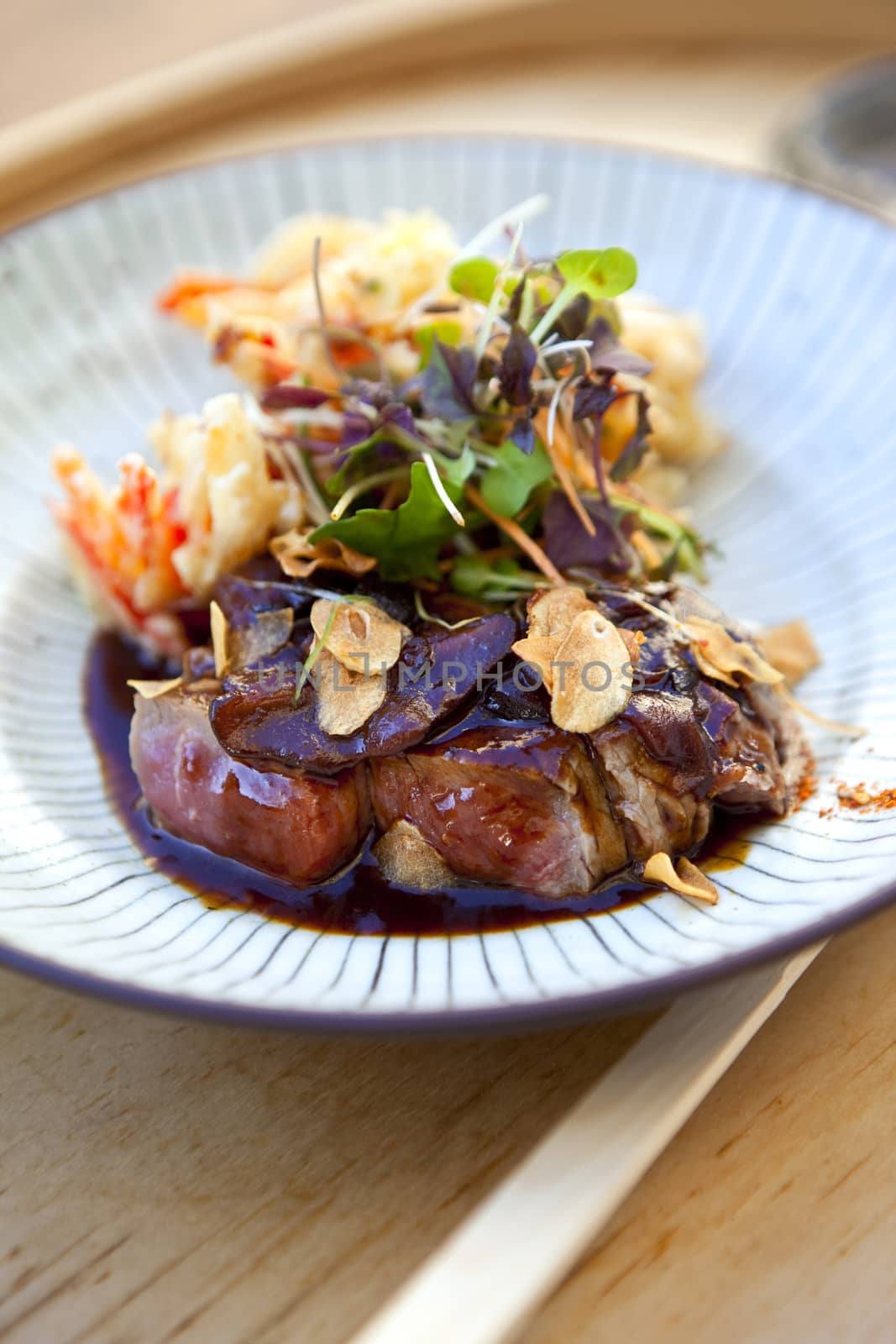 Beef, soy sauce, fried vegetable and green salad