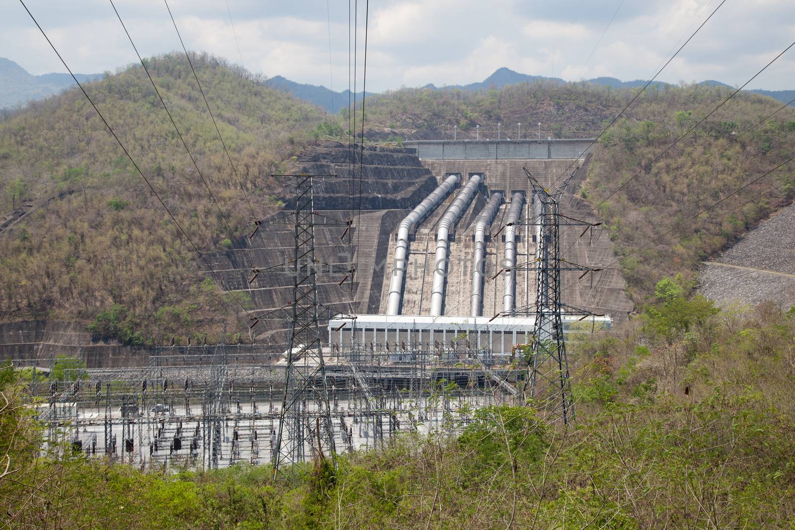 Power pole and the power plant. Transmission towers that transmit electricity from the power plant.