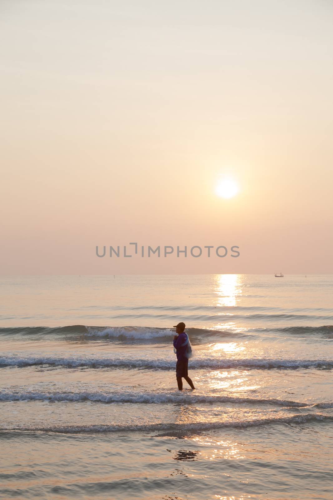 Man walking on the beach by a454