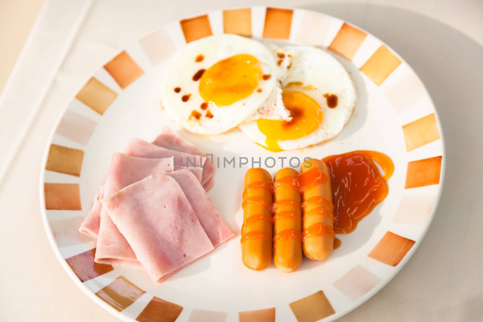 Breakfast. Sausage, ham and eggs. Supplied in a large dish for breakfast.