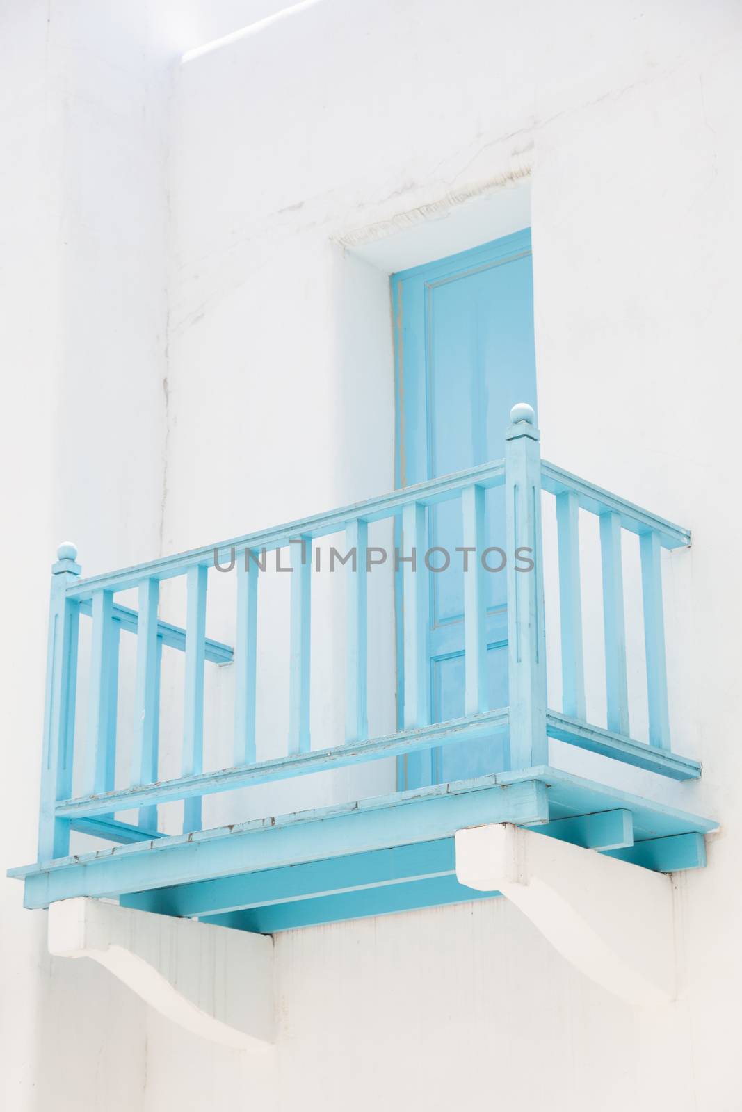 Balcony door walk out terrace of Hotel Blue. Blue wooden balcony