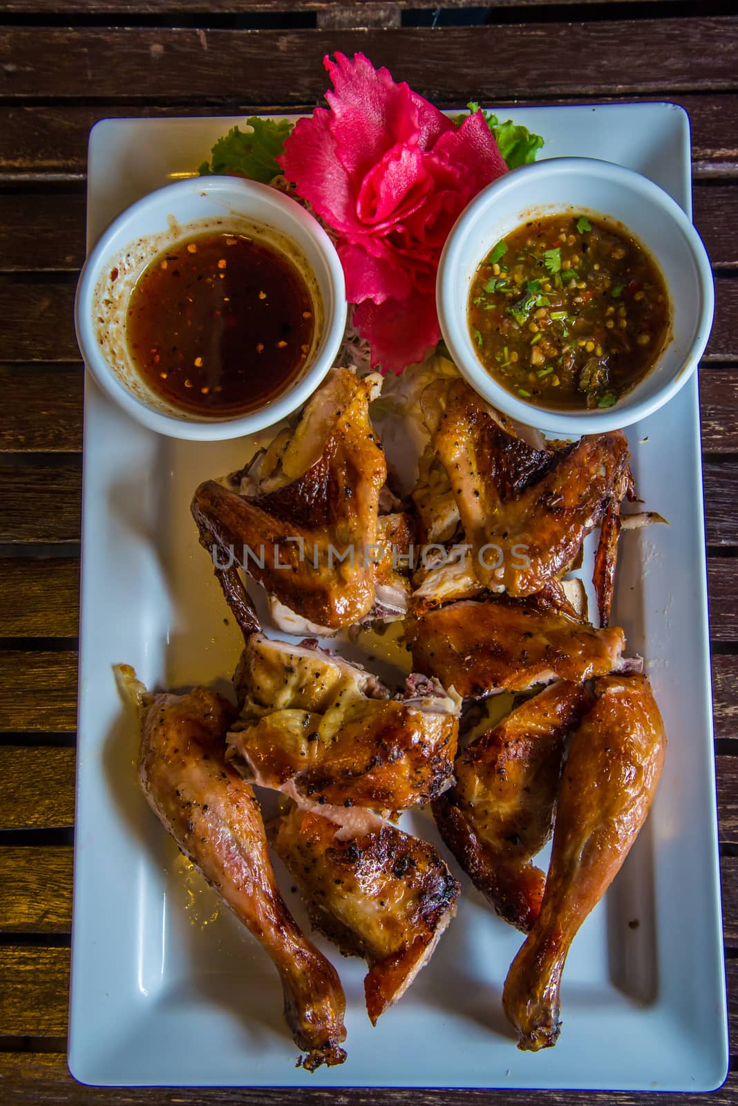 Grilled Chicken on the table in the restaurant.