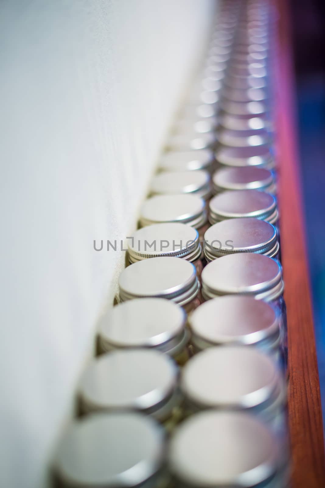Milk tablets jar on the table, depth