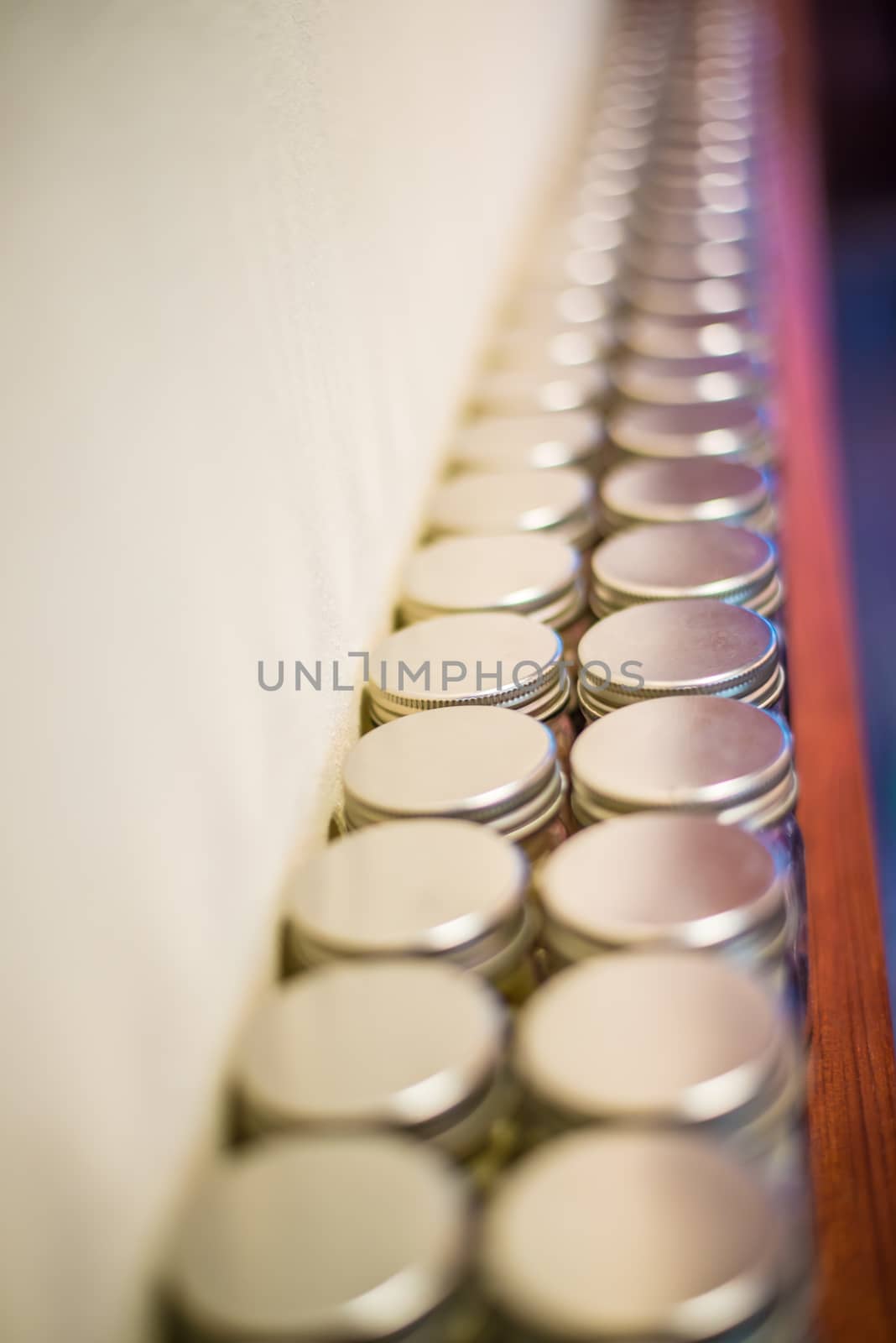 Milk tablets jar on the table, depth