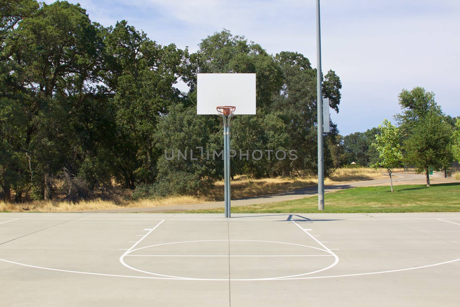 Basketball Hoop With White Backboard and Court by jhlemmer