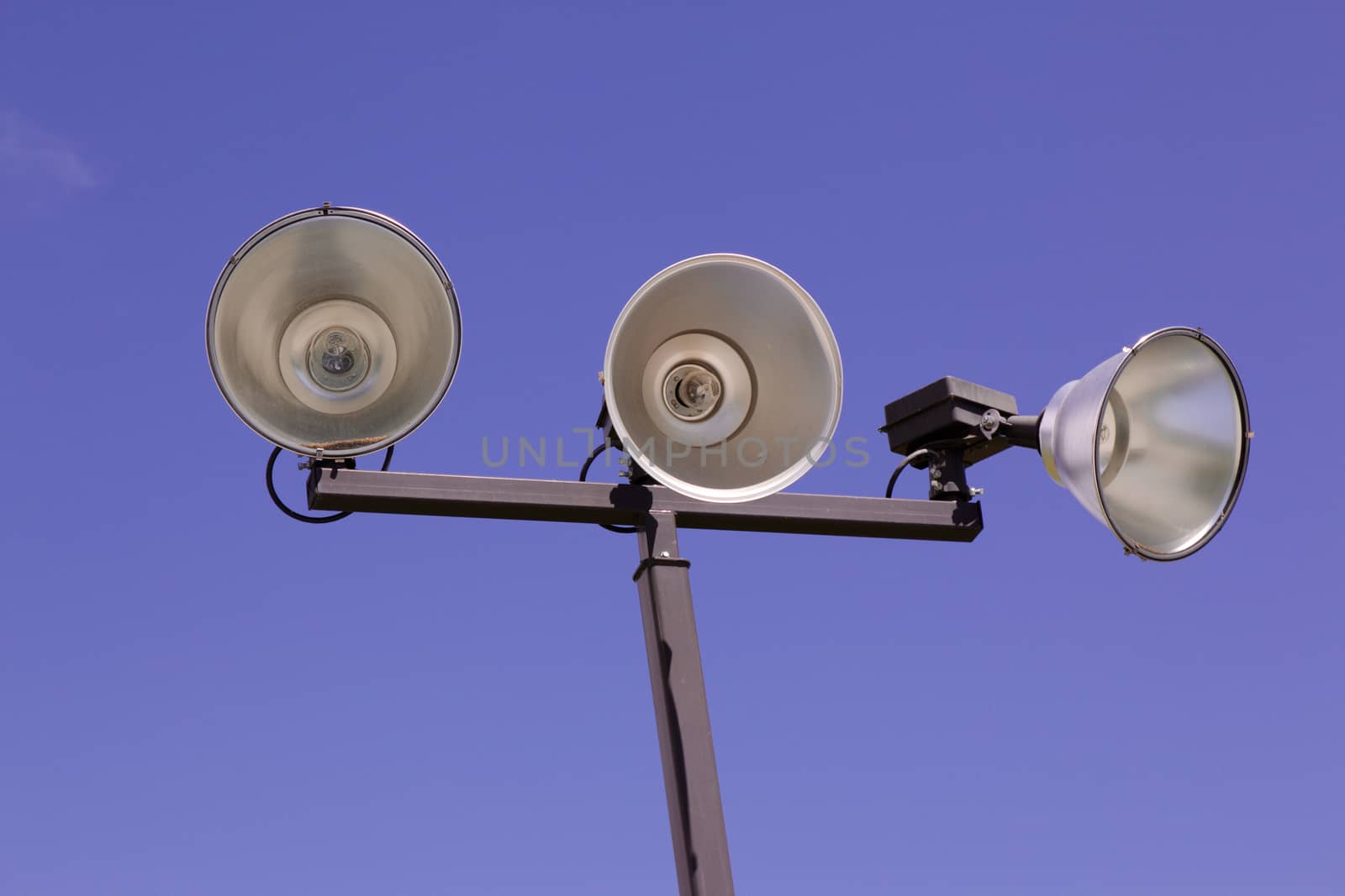 Isolated Outdoor Athletic Court Lights Against The Sky