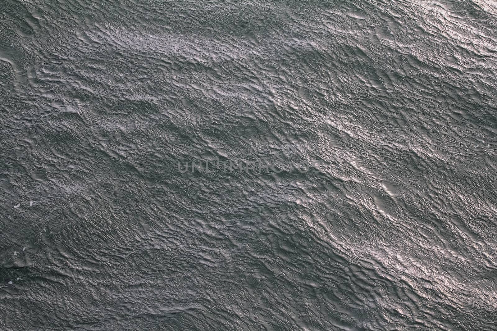 gust of heavy wind and ripples on water. View from top. Kara sea.