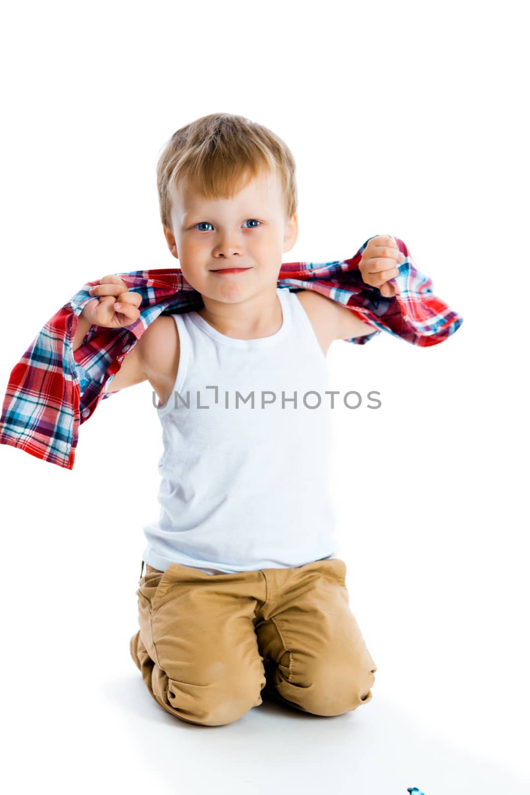 little boy in a plaid shirt over a white background.