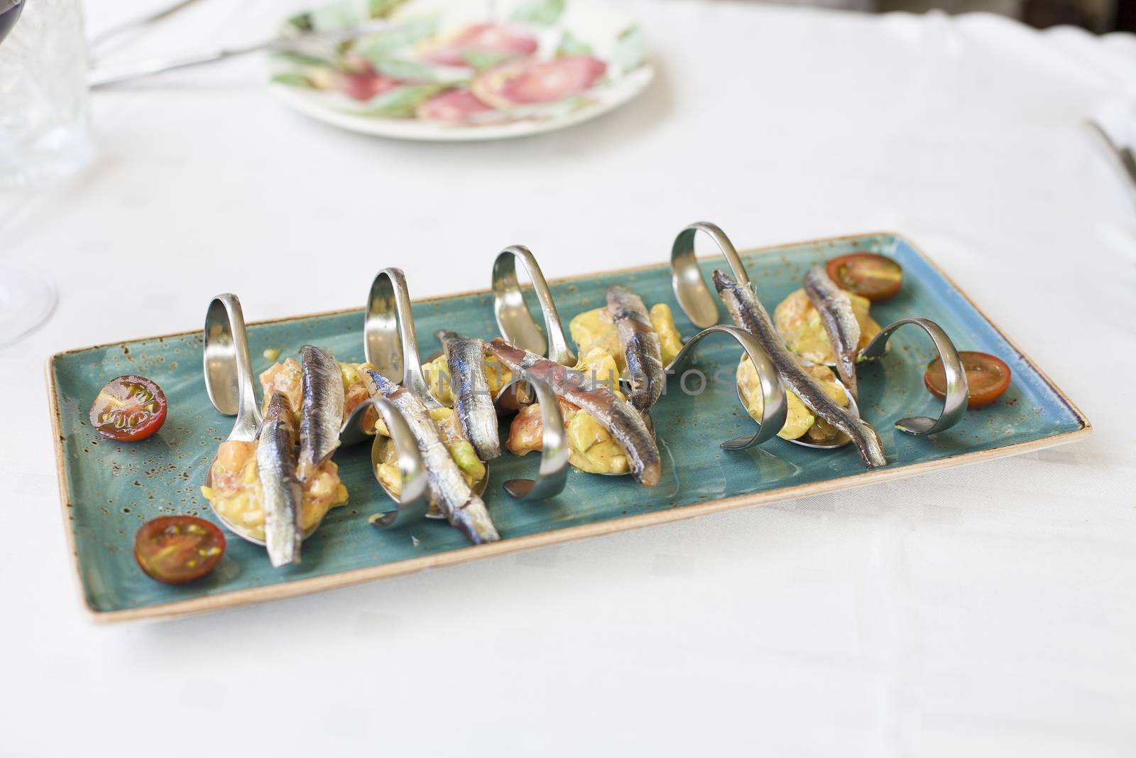 anchovies with guacamole and tomato by quintanilla