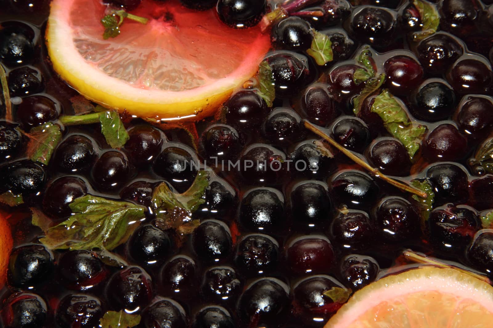 chernoplodki compote with lemon and mint in cooking