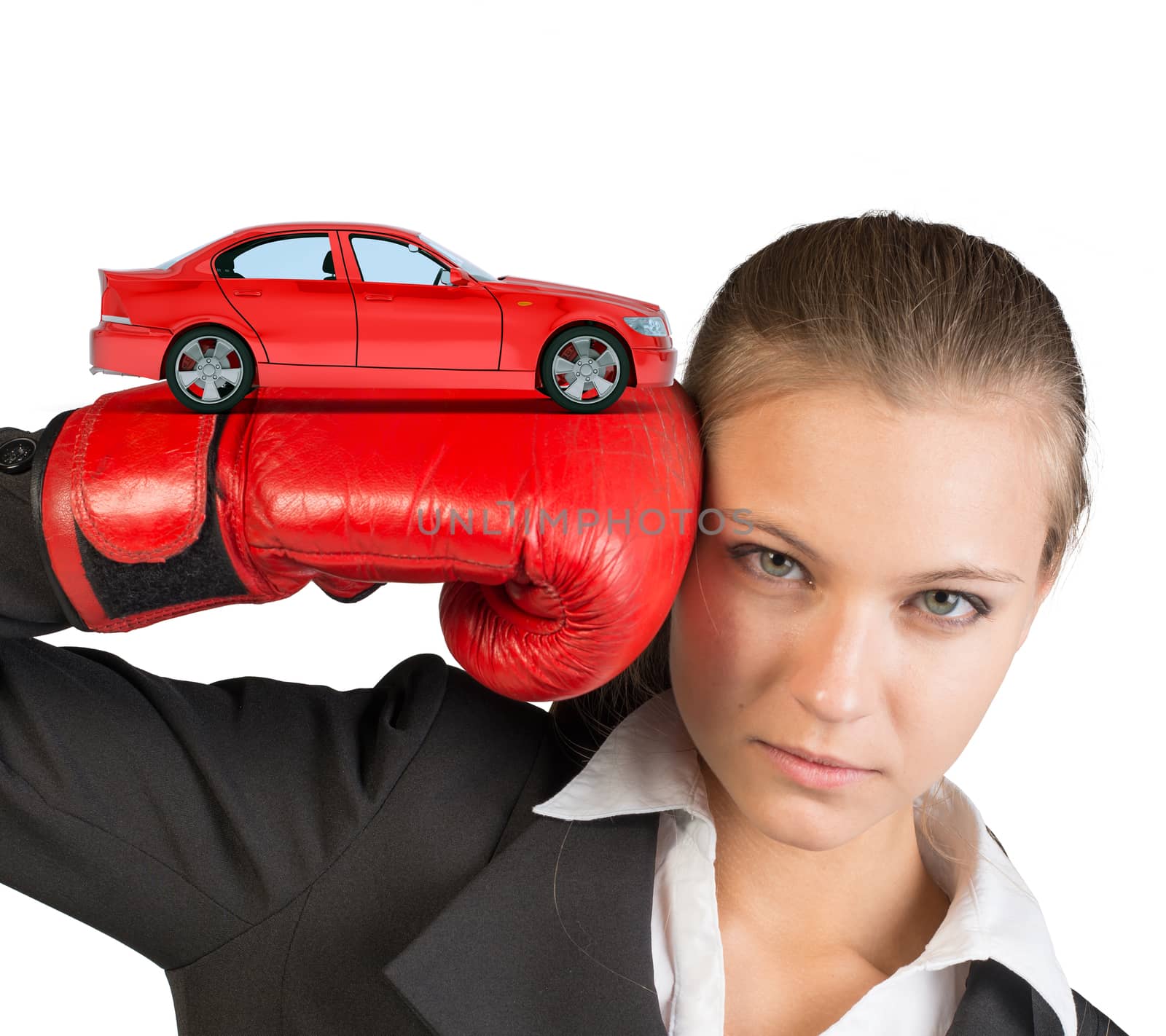 Businesswoman in boxing gloves with red car looking at camera on isolated white background