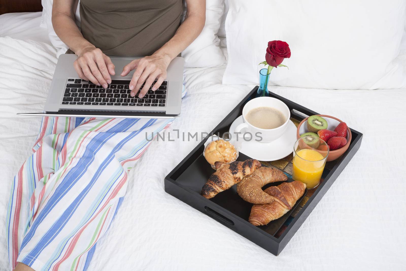 typing and breakfast on bed by quintanilla