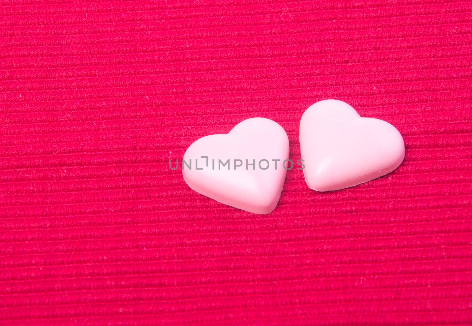 chocolate in pink colour or love shape chocolate. by heinteh