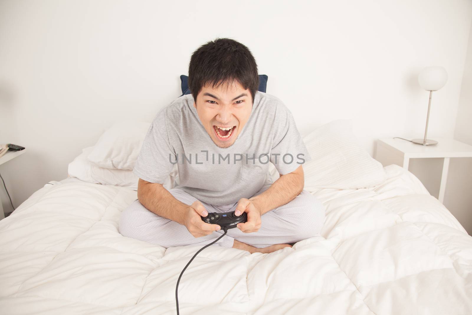 Man playing video games and shouting by ifilms