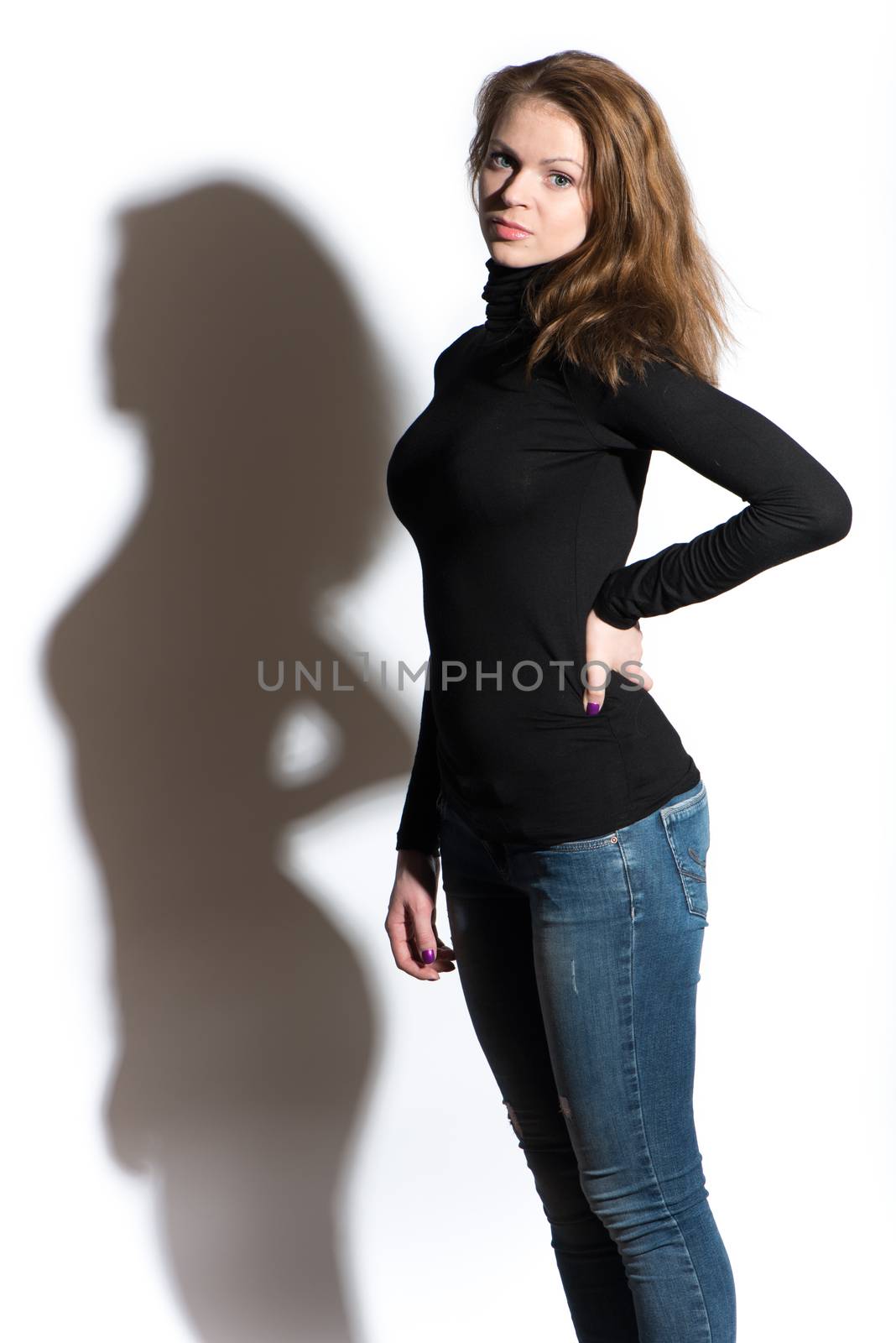 Portrait of young beautiful woman close up on white background with shadow