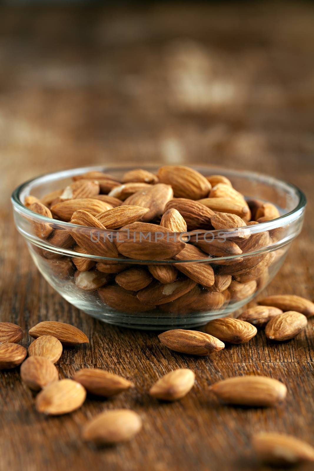 Organic almonds in raw form unroasted and unsalted.  Close up macro still life with a shallow depth of field.