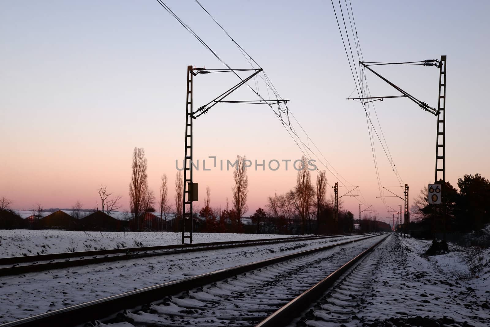 Railroad platform over sunset by dk_photos