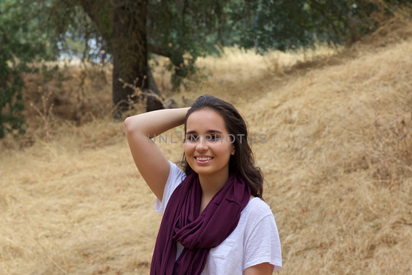 Attractive young teenage girl in a park