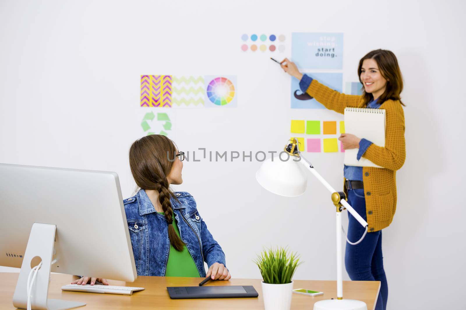 Women working at desk In a creative office, team work 
