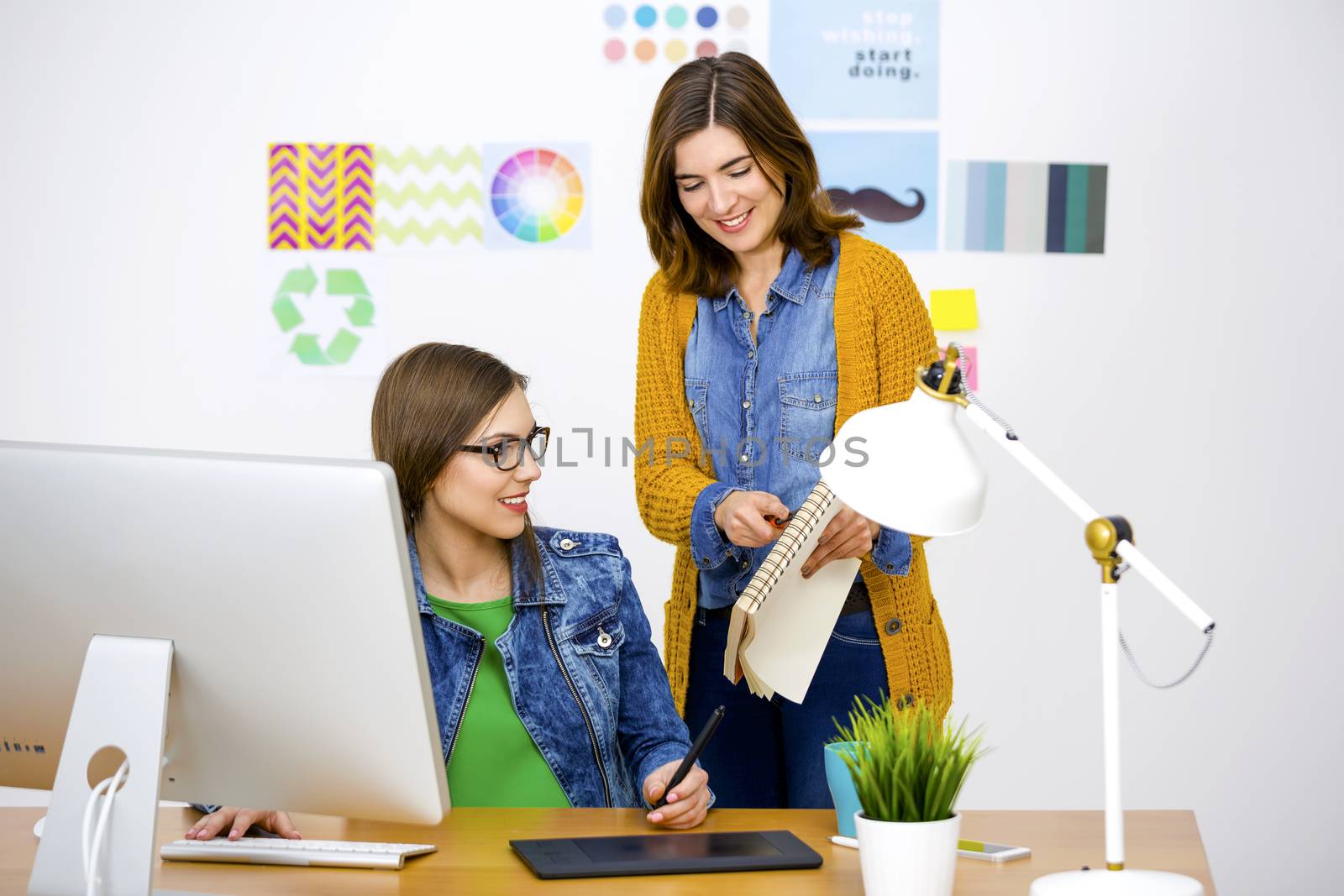 Women working at desk In a creative office, team work 