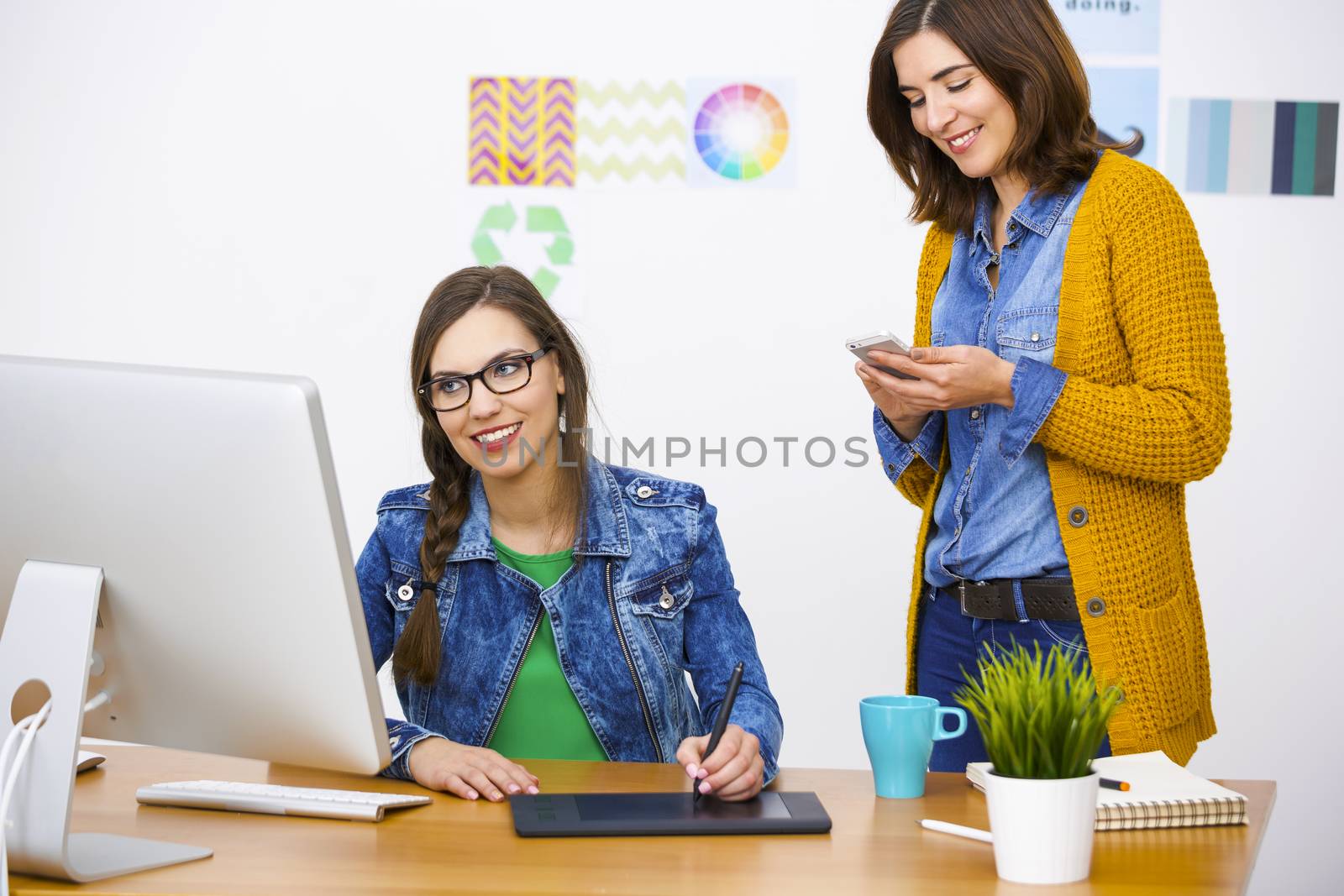 Women working at desk In a creative office, team work 