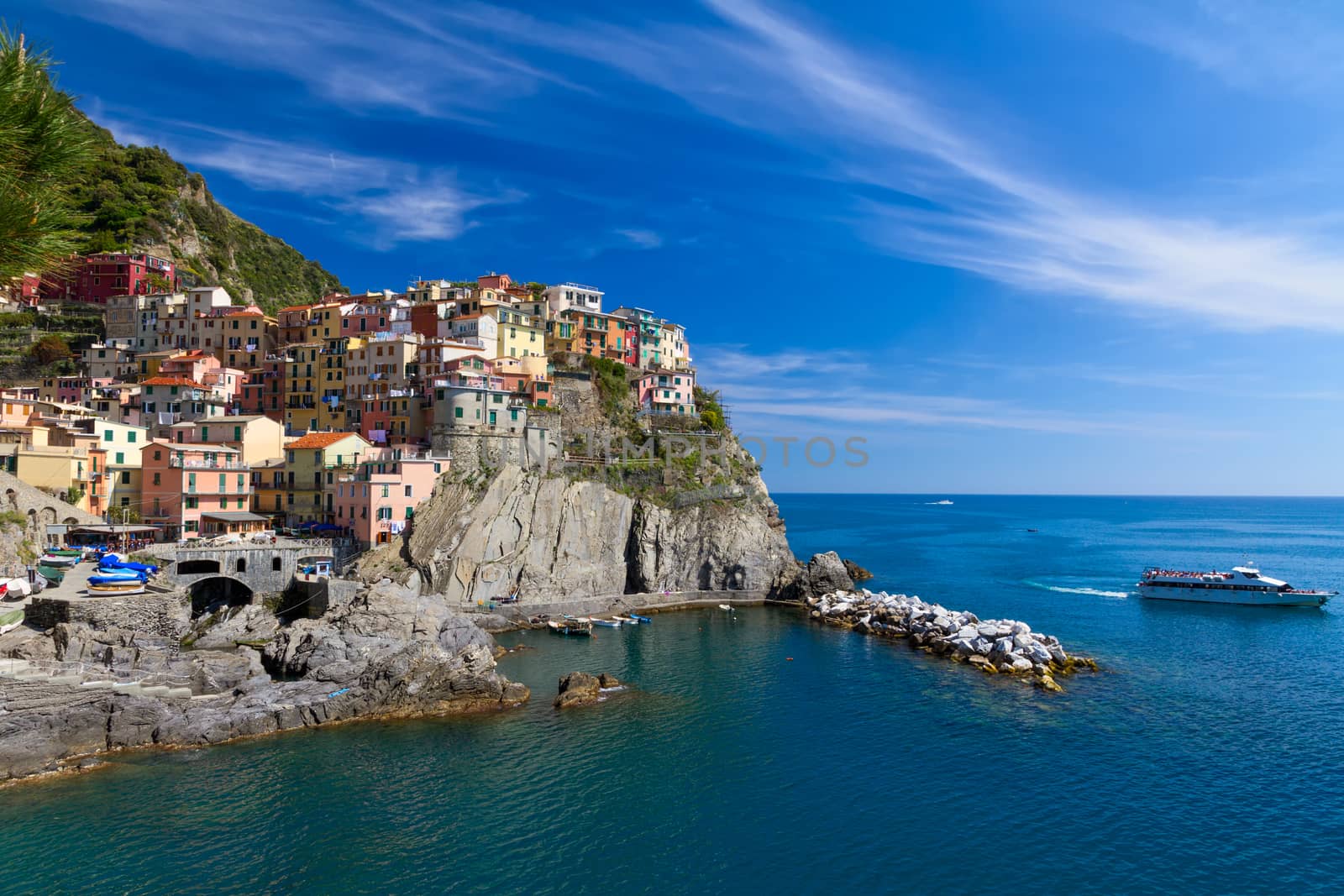 Village of Manarola with ferry, Cinque Terre, Italy by fisfra