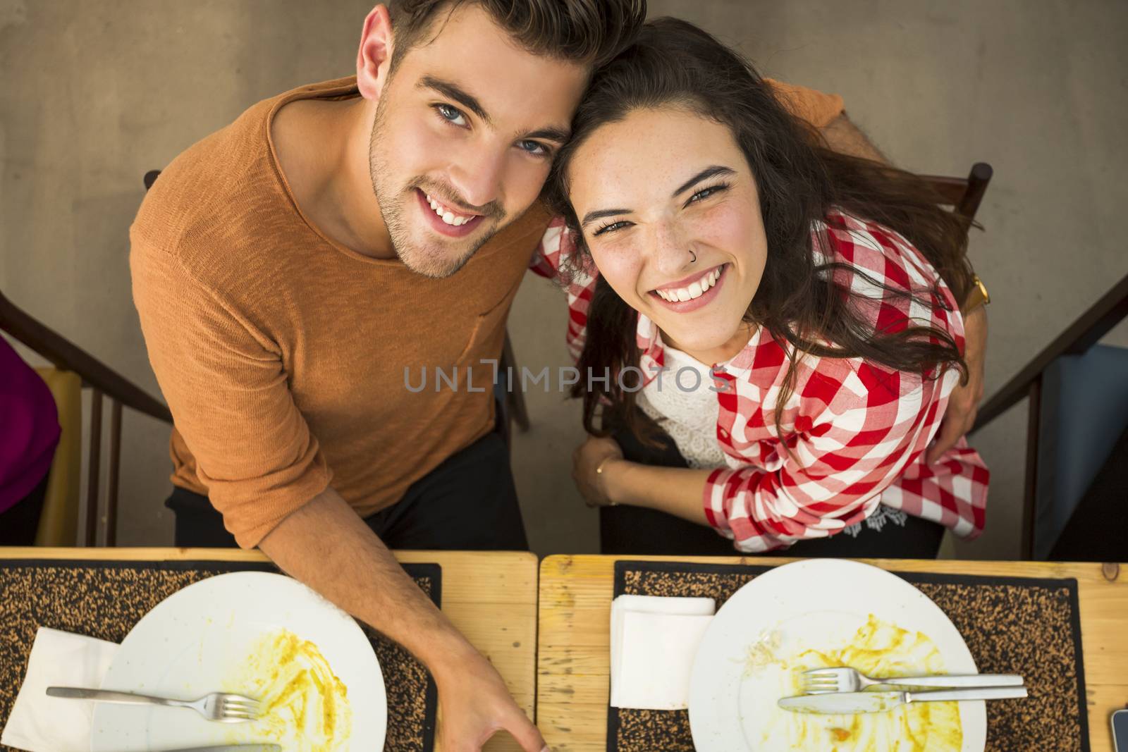 Top view of a young couple at the restaurant having a good time 