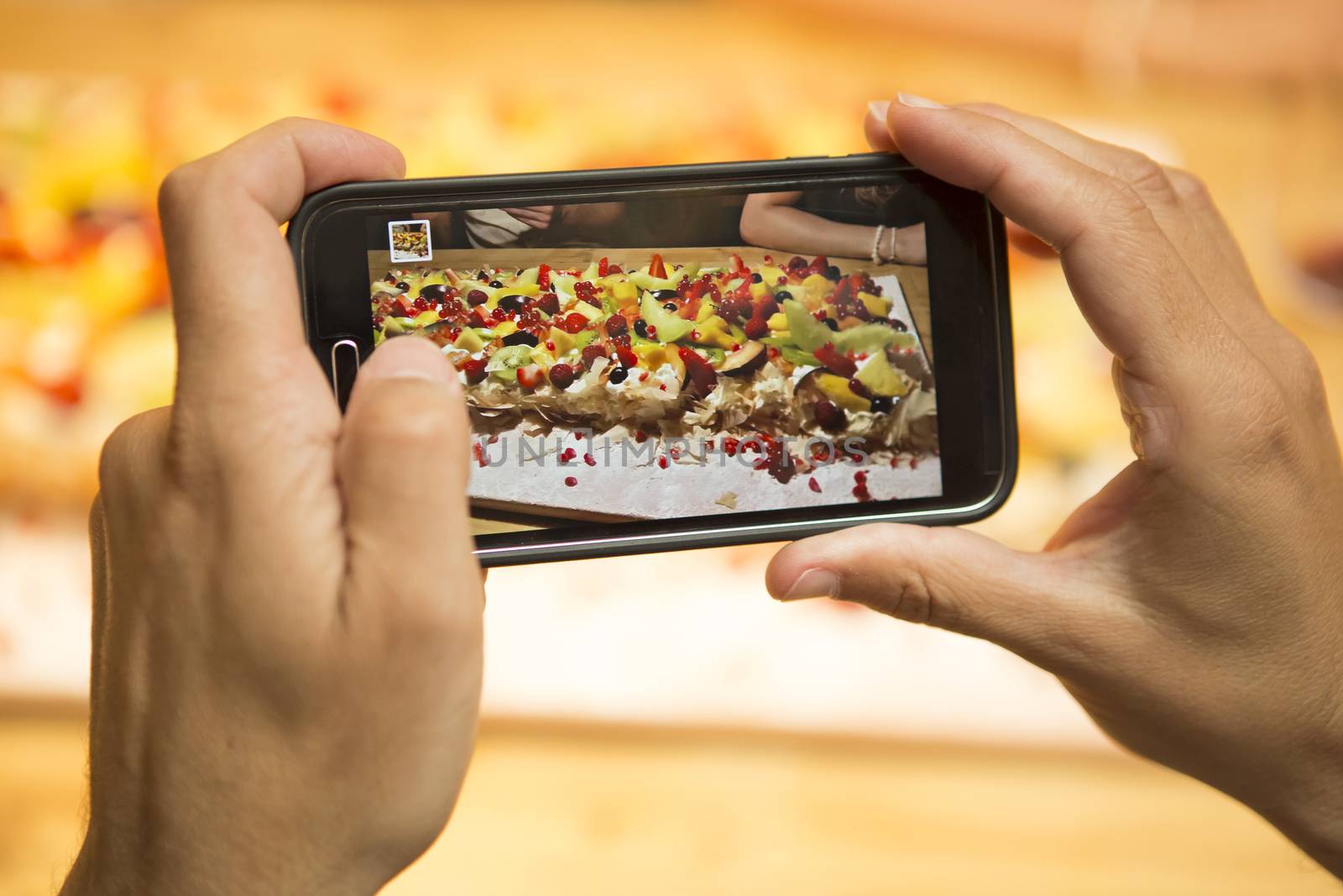 Taking a picture of the dessert at the restaurant