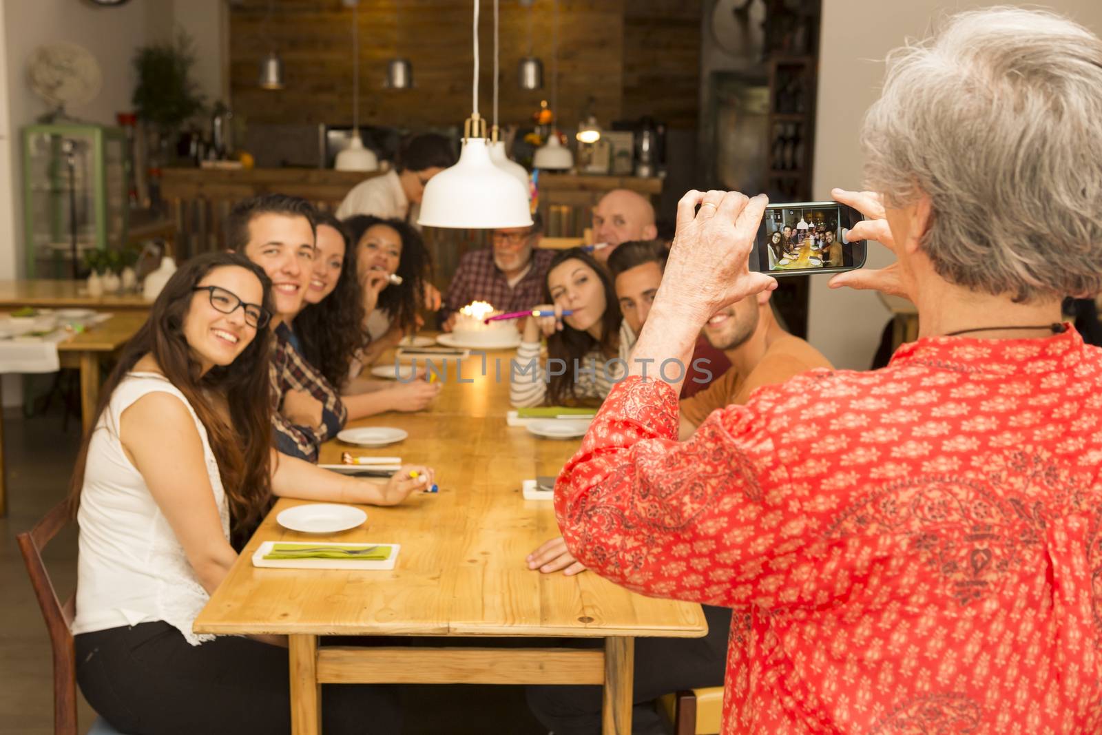 Granny taking a picture of all family by Iko