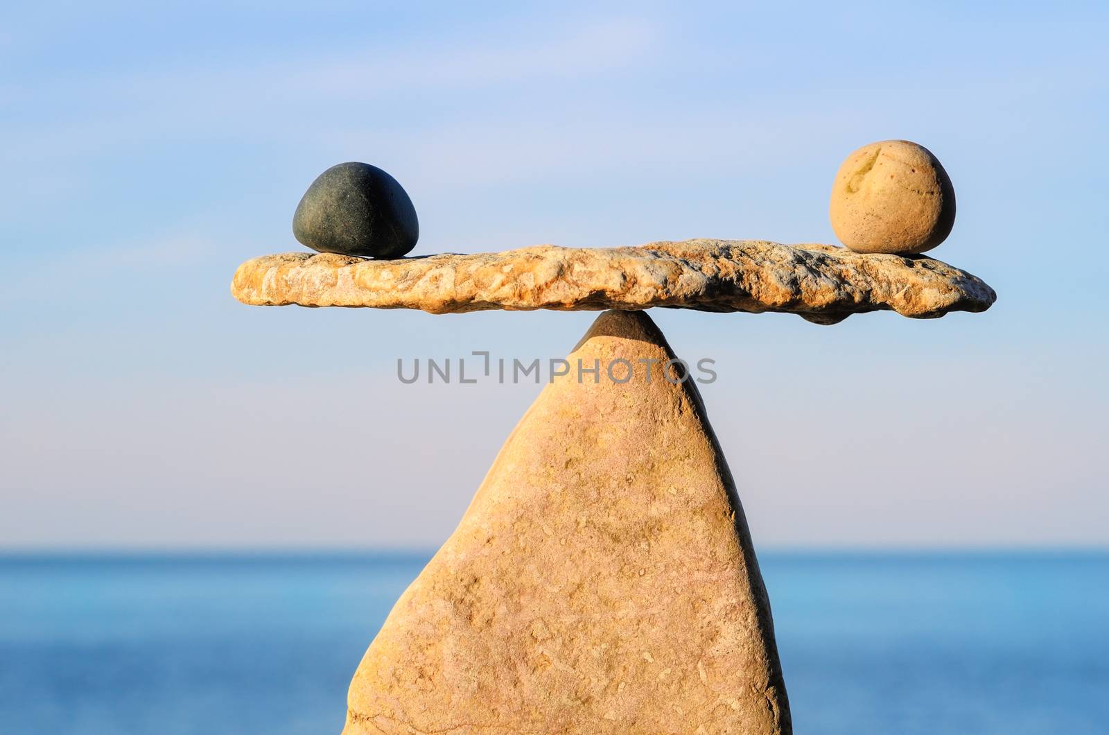 Well-balanced of pebbles on the top of stone