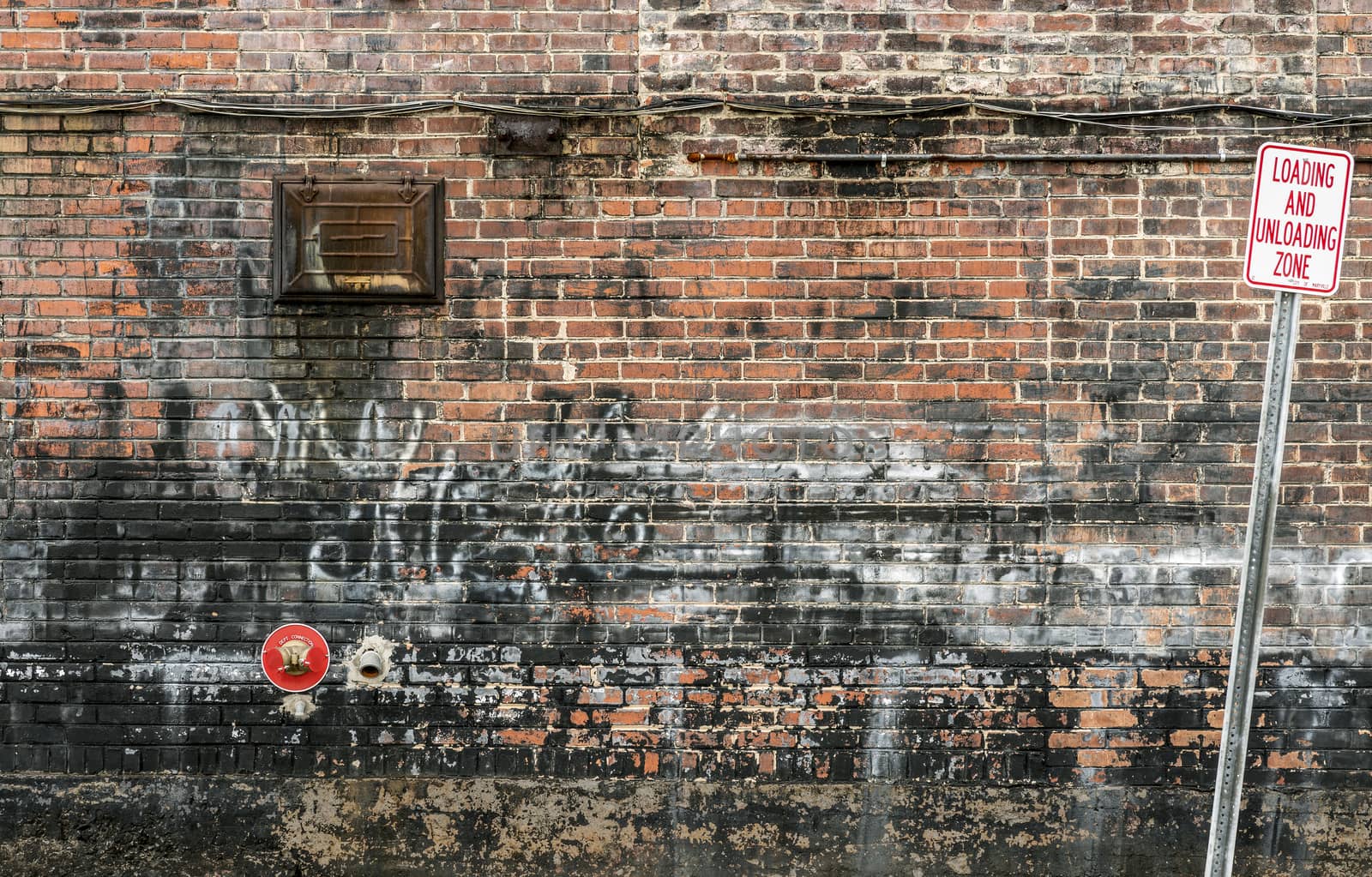 Grungy Brick Wall With Graffiti Background by stockbuster1