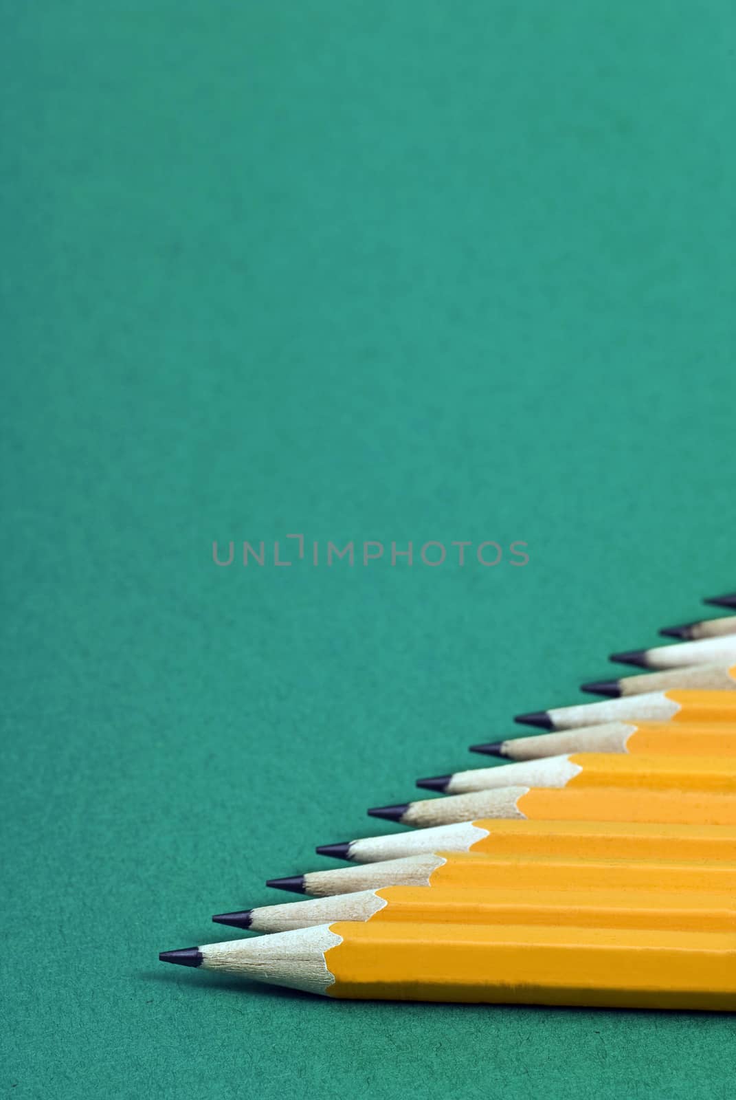 Yellow Pencils Focus On Foreground Vertical by stockbuster1