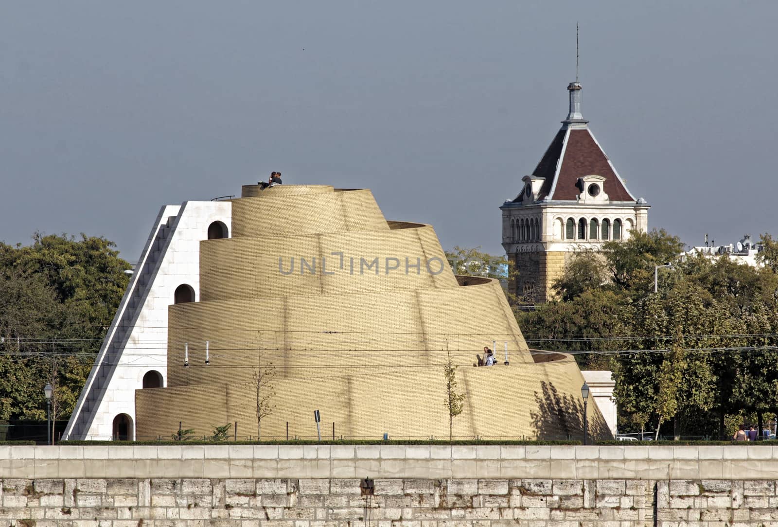 Modern pyramid snail lookout tower Backlight old factory.