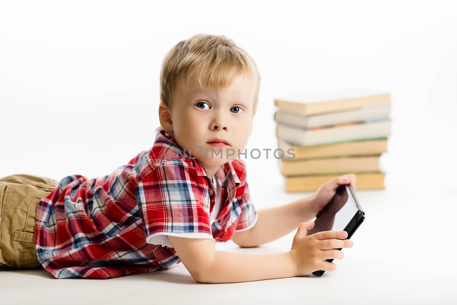 Little boy with a Tablet PC. studio