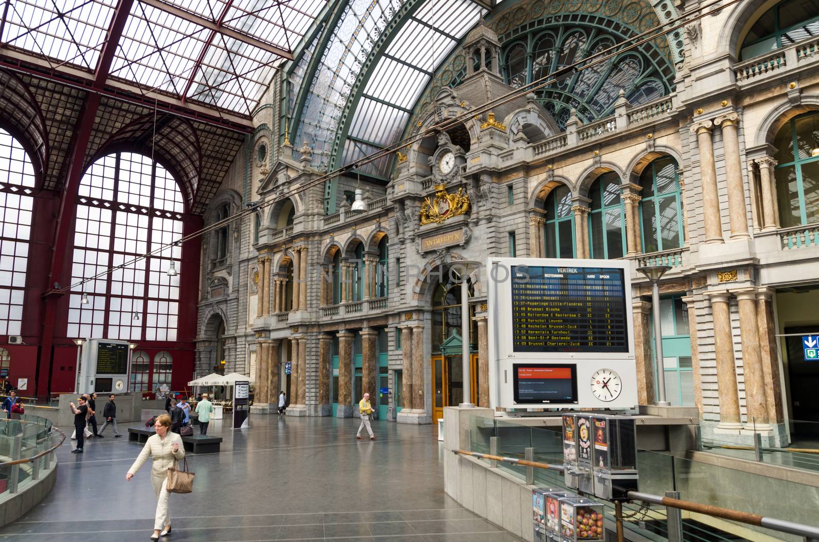 Antwerp, Belgium - May 11, 2015: People in Main hall of Antwerp Central station on May 11, 2015 in Antwerp, Belgium. The station is now widely regarded as the finest example of railway architecture in Belgium.