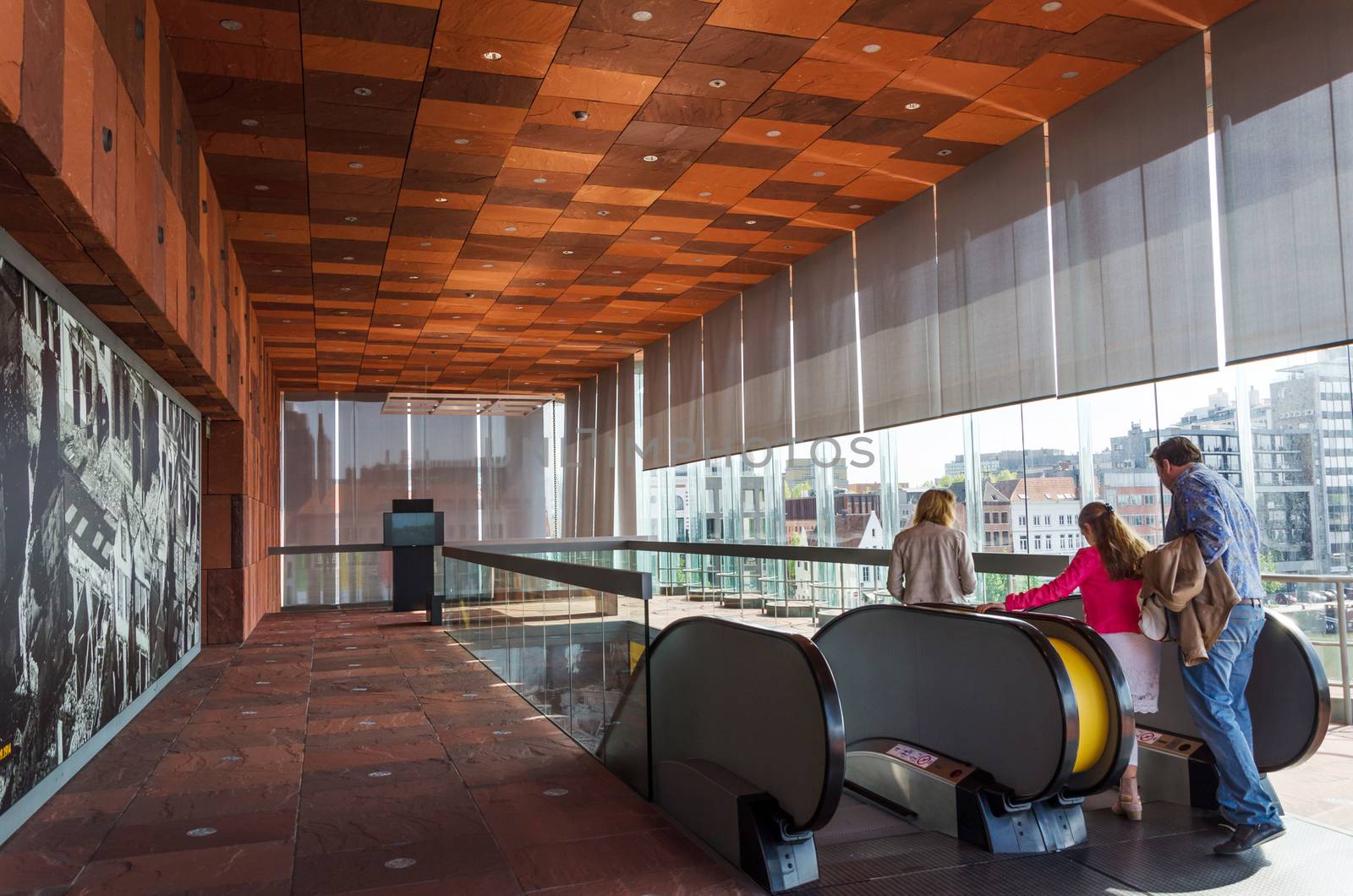 Antwerp, Belgium - May 10, 2015: People visit Museum aan de Stroom (MAS) along the river Scheldt in the Eilandje district of Antwerp, Belgium, on May 10, 2015. Opened in May 2011, is the largest museum in Antwerp.