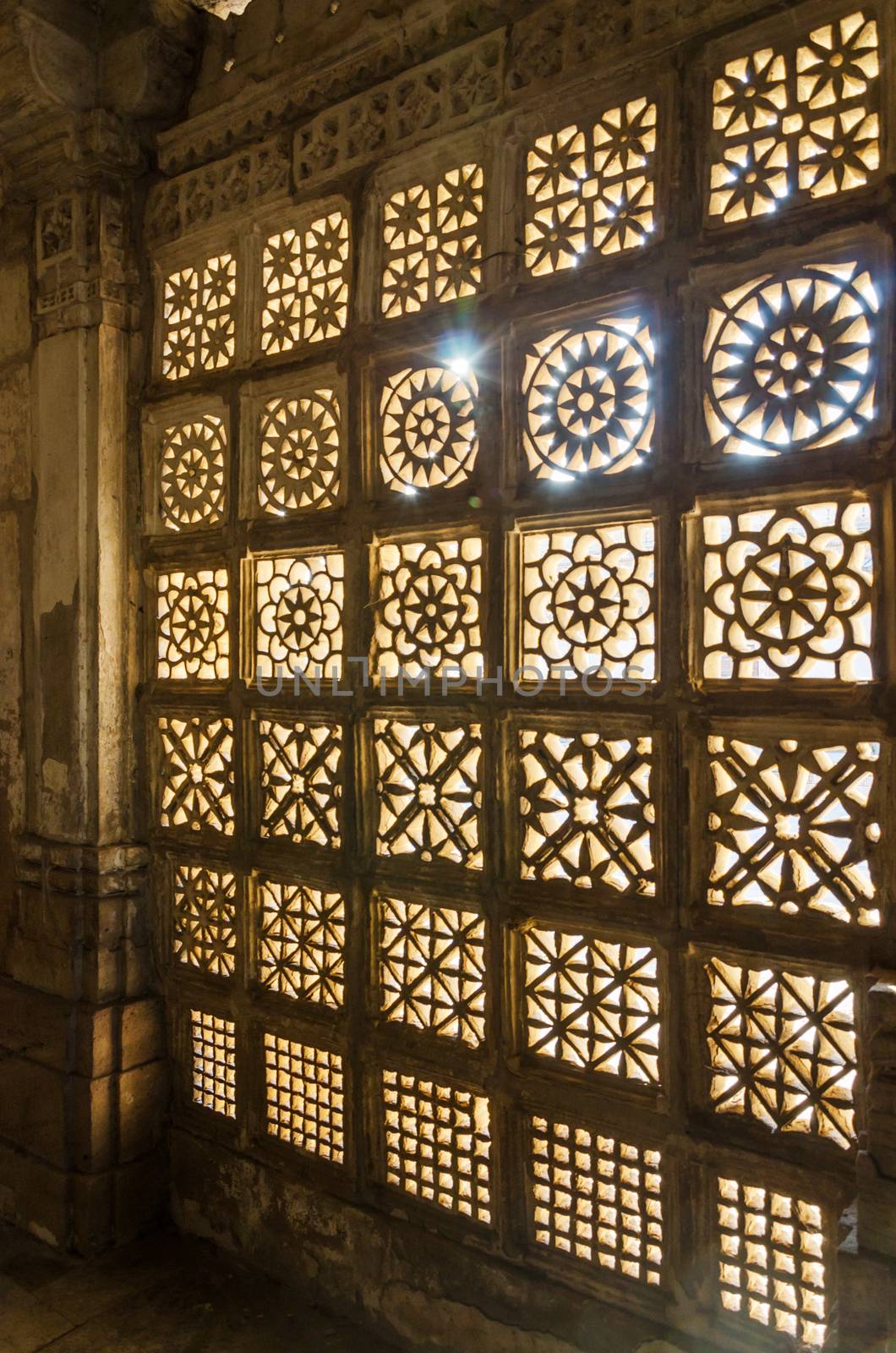 Carved stone grilles pattern at Sarkhej Roza mosque in Ahmedabad, India