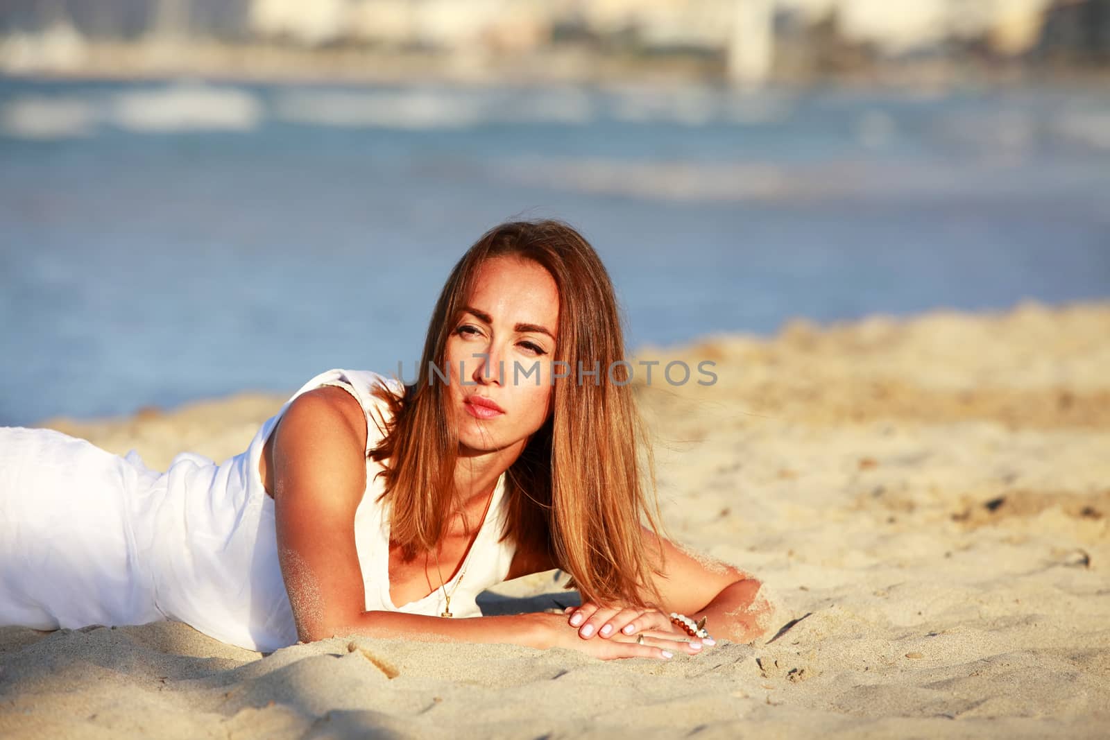 The girl on coastline ocean admires nature