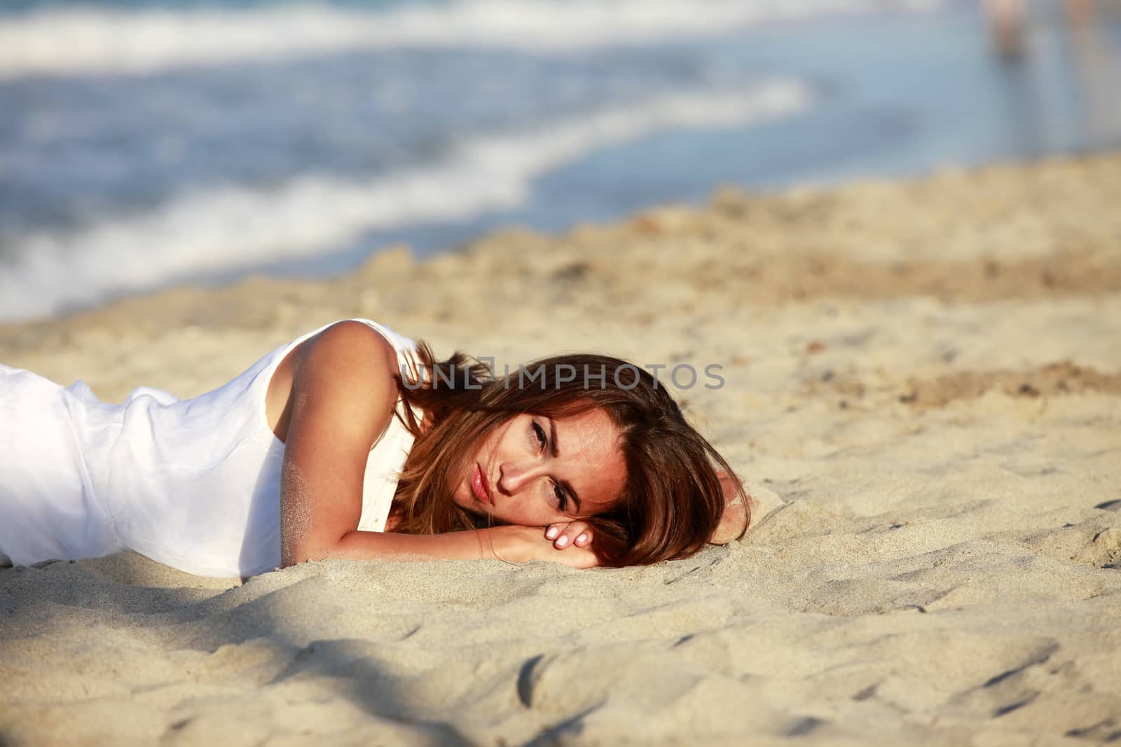 The girl on coastline ocean admires nature