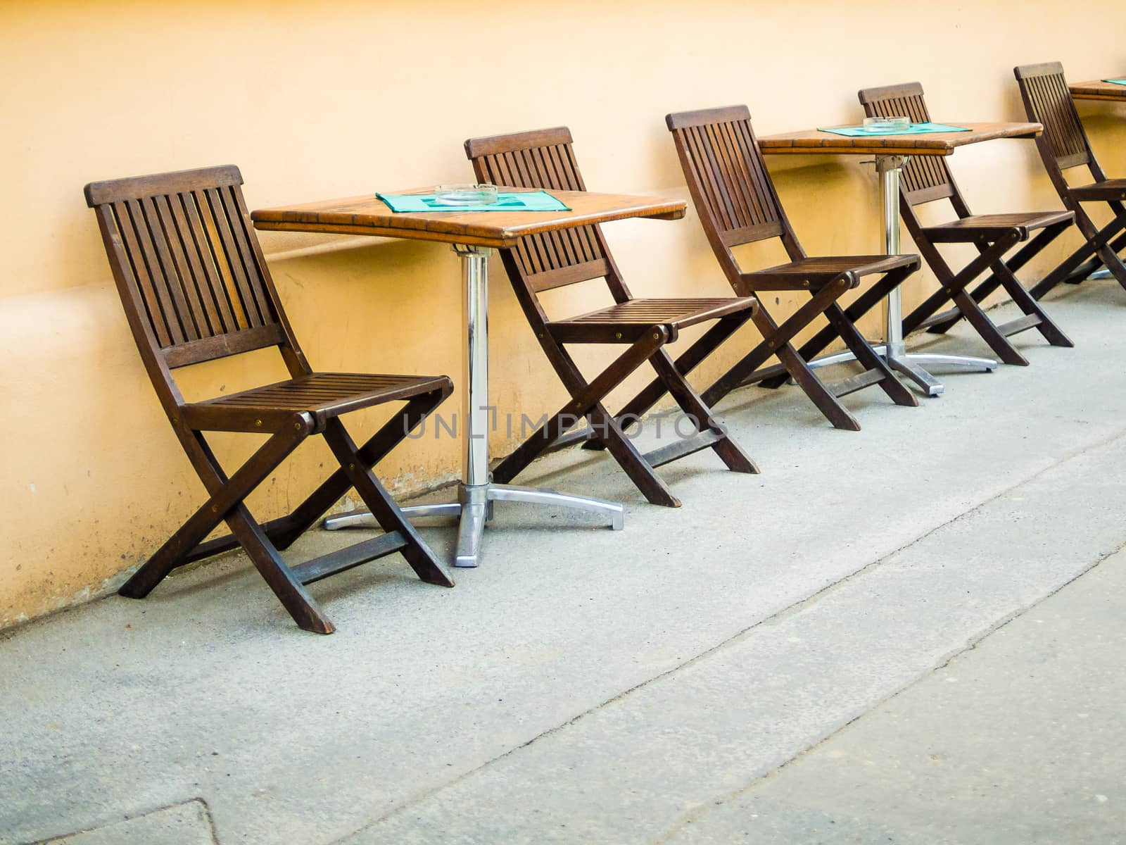 Chairs and tables on the street - coffe, pub, restaurant, summer time setting