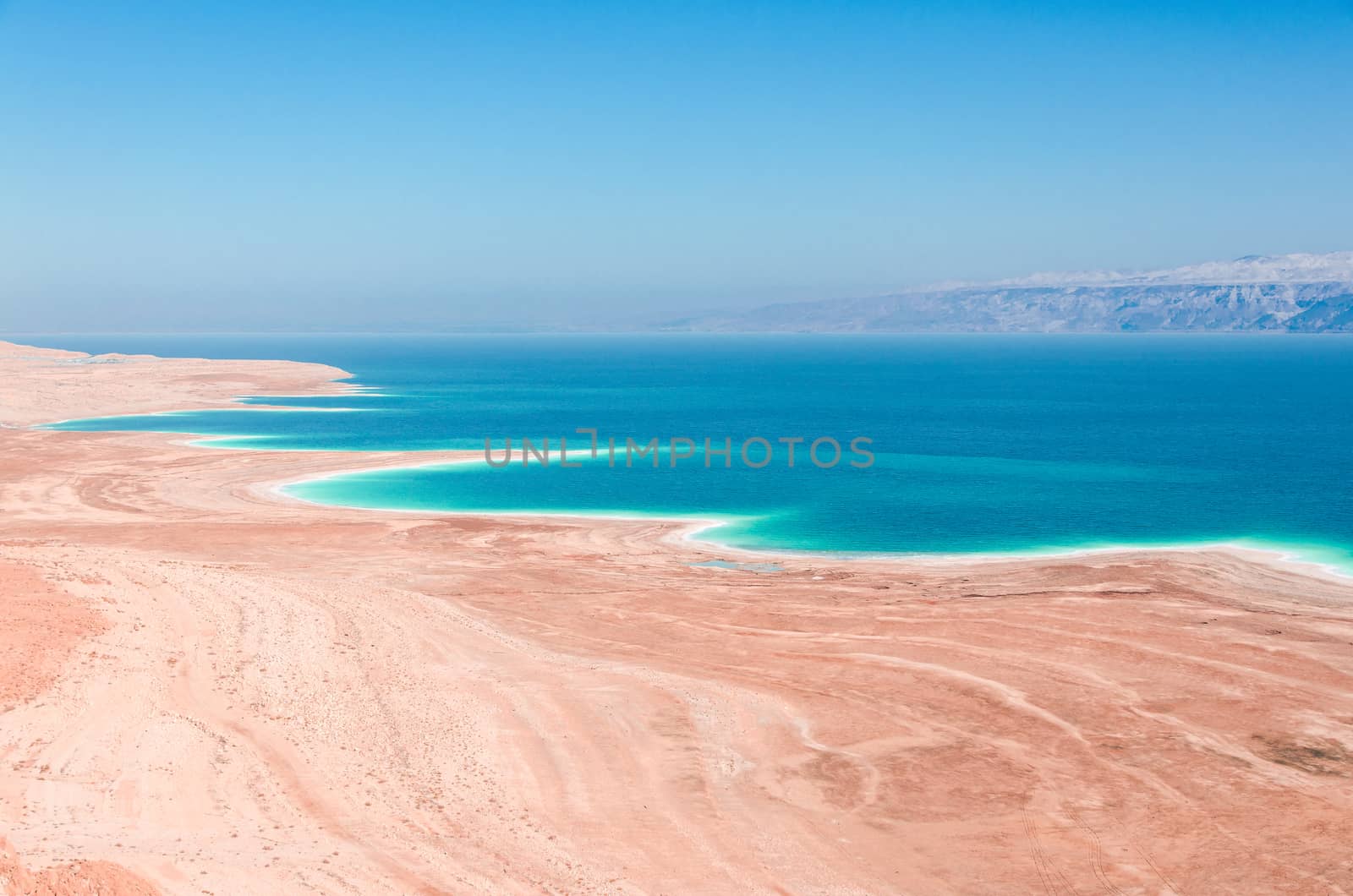 Dead Sea coastline in desert uninhabited extraterrestrial landscape aerial view