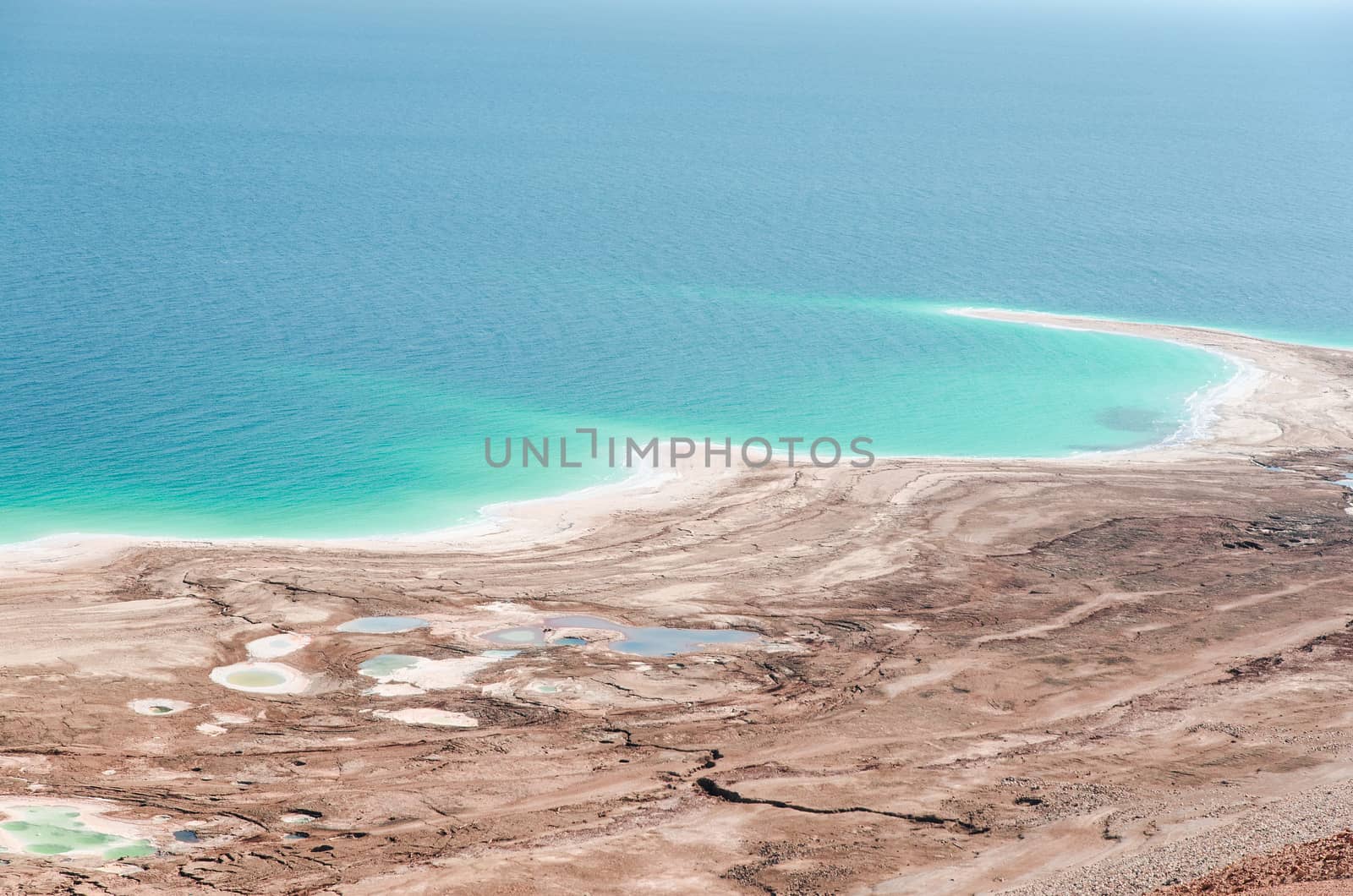 Natural environmental disaster on Dead Sea shores. Water level decreases and surface rapidly shrinking due to human activity.