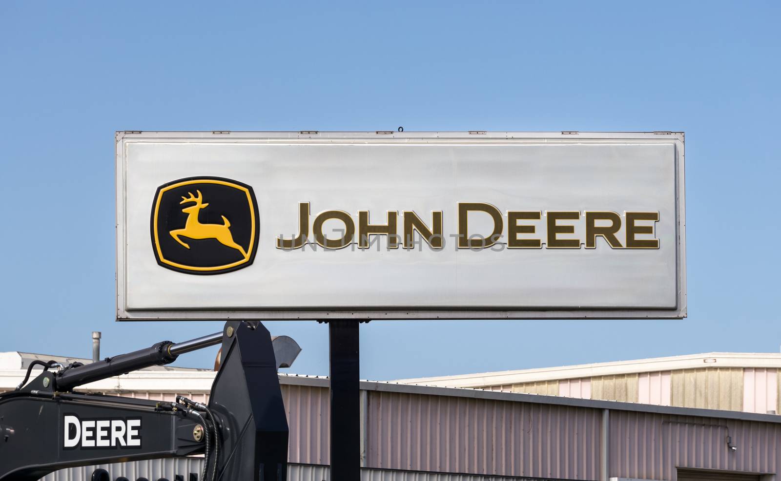 LOS ANGELES, CA/USA - JULY 11, 2015: John Deere equipment dealership sign and logo. Deere & Company is an American corporation that manufactures agricultural, construction and lawn care equipment.