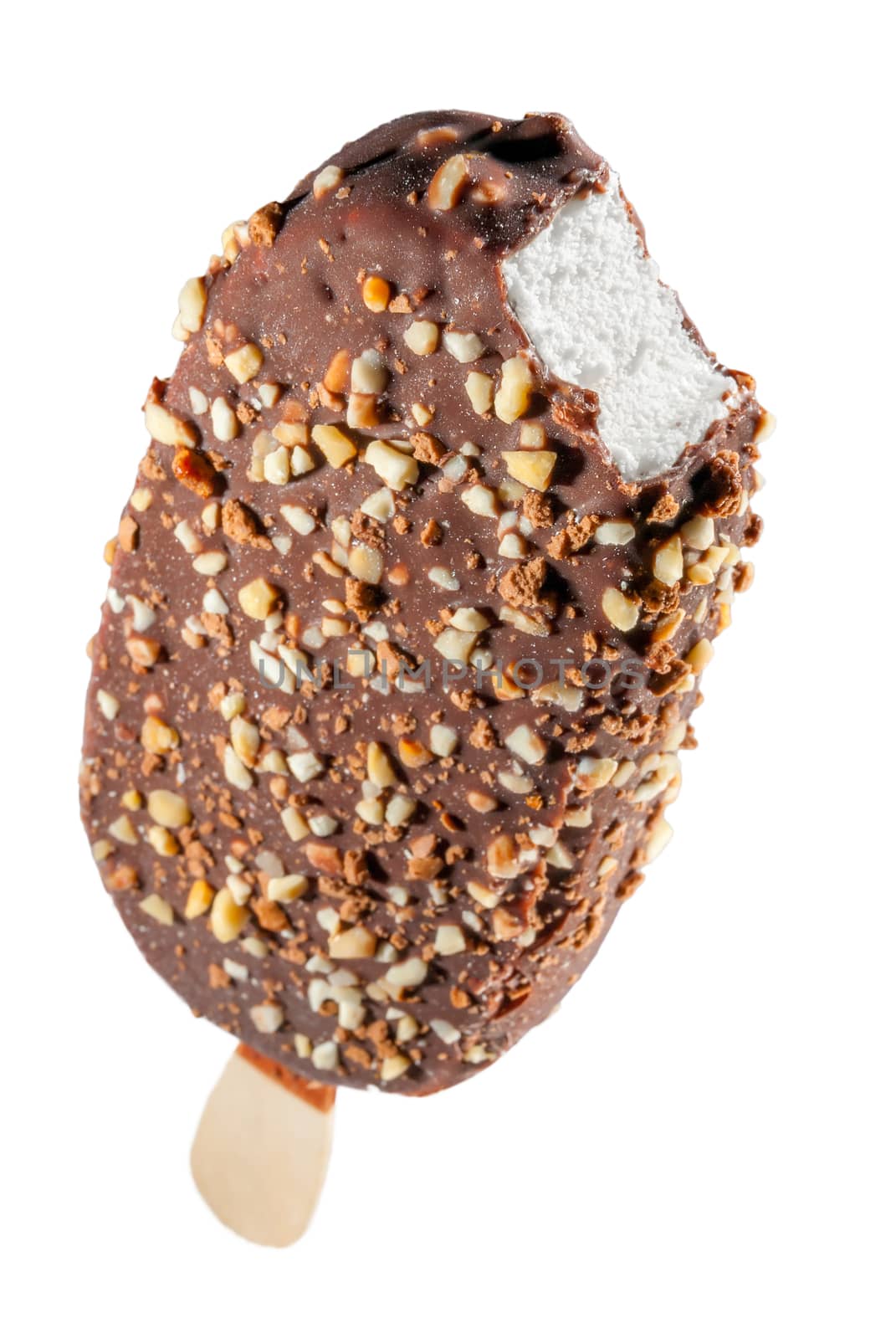 creamy popsicle in dark chocolate with nuts on a white background